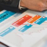 Loan officer reviewing mortgage rate history document to calculate discount point breakeven math