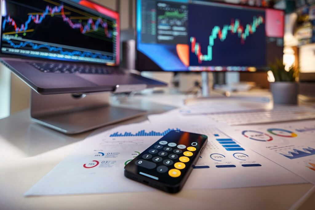 Financial analytics dashboard with calculator and charts representing paid mortgage lead channel cost tracking